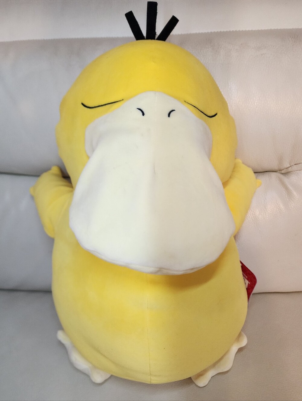 The Pokemon Psyduck Kids' Sleeping Plush is an 18-inch stuffed animal featuring